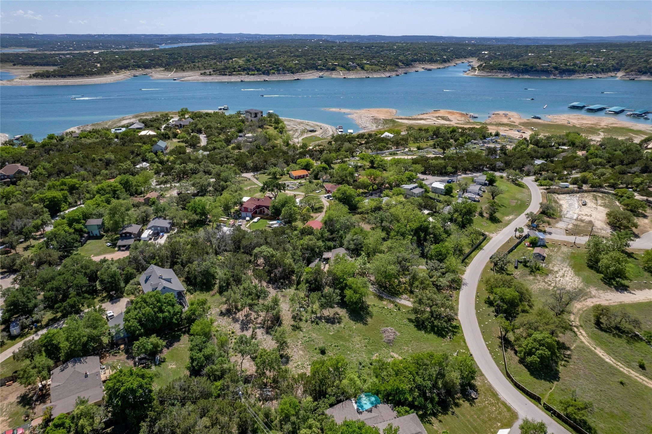 17168 Rocky Ridge Road Austin, TX 78734 - Photo 1 of 20 Aerial perspective of suburban area with a nearby body of water