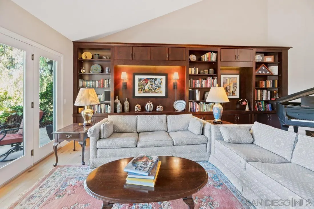 12904 Stone Canyon Road Poway, CA 92064 - Photo 13 of 72 a living room with furniture and floor to ceiling window