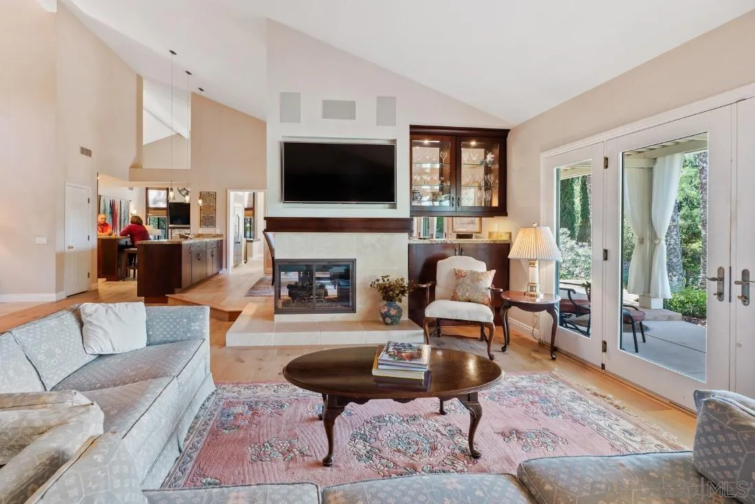 12904 Stone Canyon Road Poway, CA 92064 - Photo 14 of 72 a living room with furniture fireplace and a flat screen tv