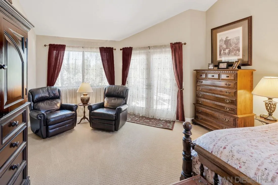 12904 Stone Canyon Road Poway, CA 92064 - Photo 17 of 72 a living room with furniture and a flat screen tv