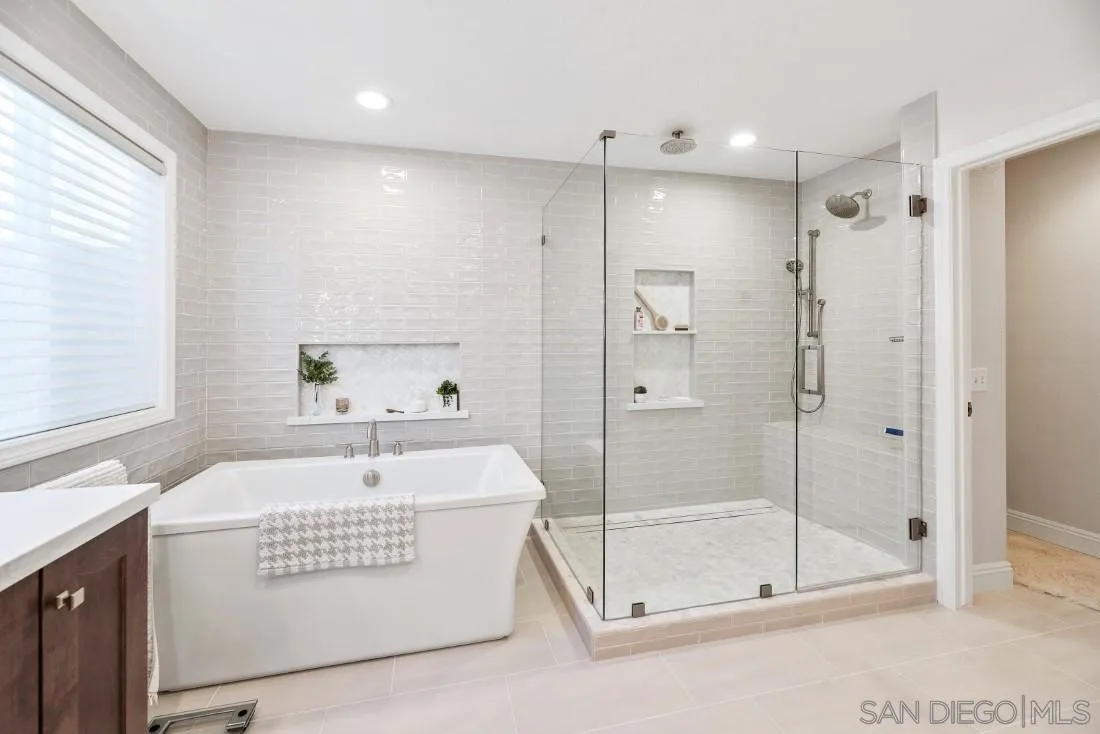 12904 Stone Canyon Road Poway, CA 92064 - Photo 20 of 72 a bathroom with a shower a sink and a mirror