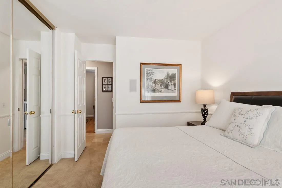 12904 Stone Canyon Road Poway, CA 92064 - Photo 28 of 72 a bedroom with a bed and a painting on the wall
