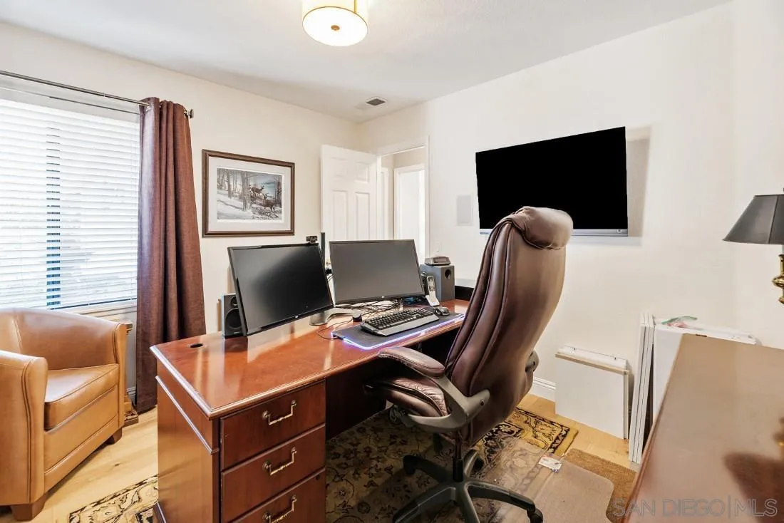 12904 Stone Canyon Road Poway, CA 92064 - Photo 29 of 72 a view of a workspace with furniture and a window