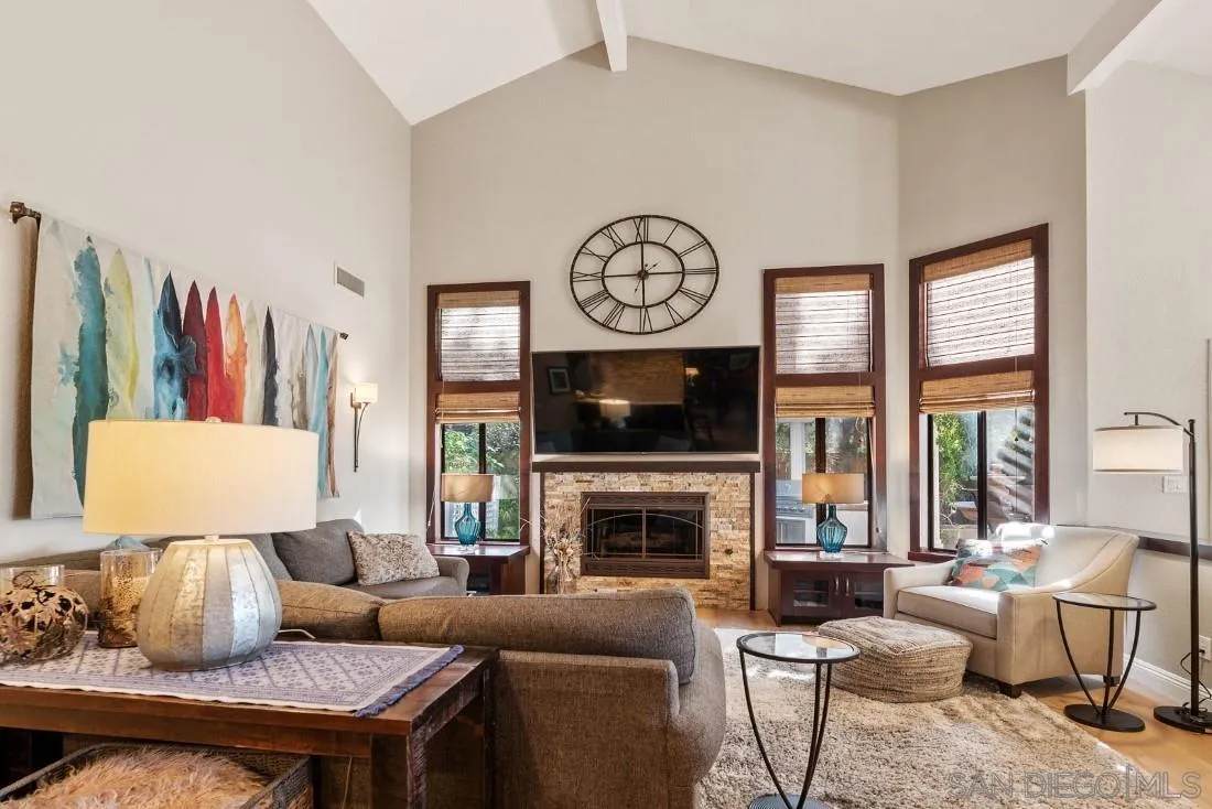 12904 Stone Canyon Road Poway, CA 92064 - Photo 33 of 72 a living room with furniture a fireplace and a large window