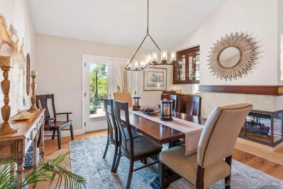 12904 Stone Canyon Road Poway, CA 92064 - Photo 42 of 72 a view of a dining room with furniture and window
