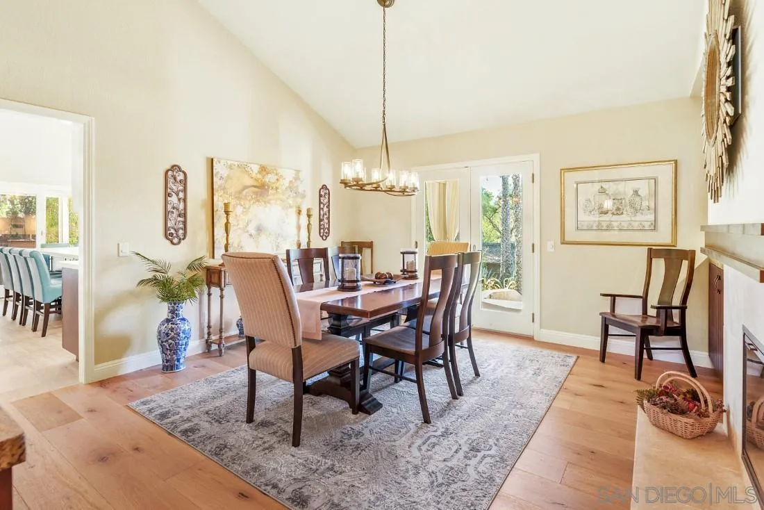 12904 Stone Canyon Road Poway, CA 92064 - Photo 44 of 72 a dining room with furniture and wooden floor
