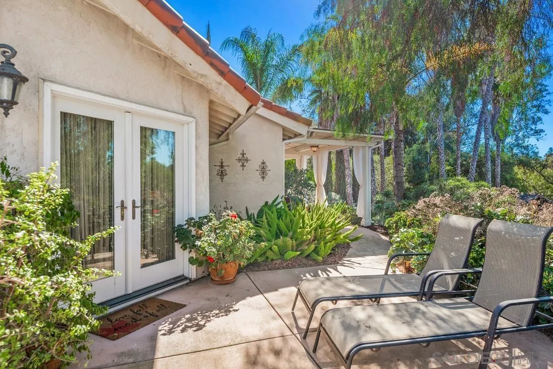 12904 Stone Canyon Road Poway, CA 92064 - Photo 59 of 72 a view of backyard with outdoor seating and plants