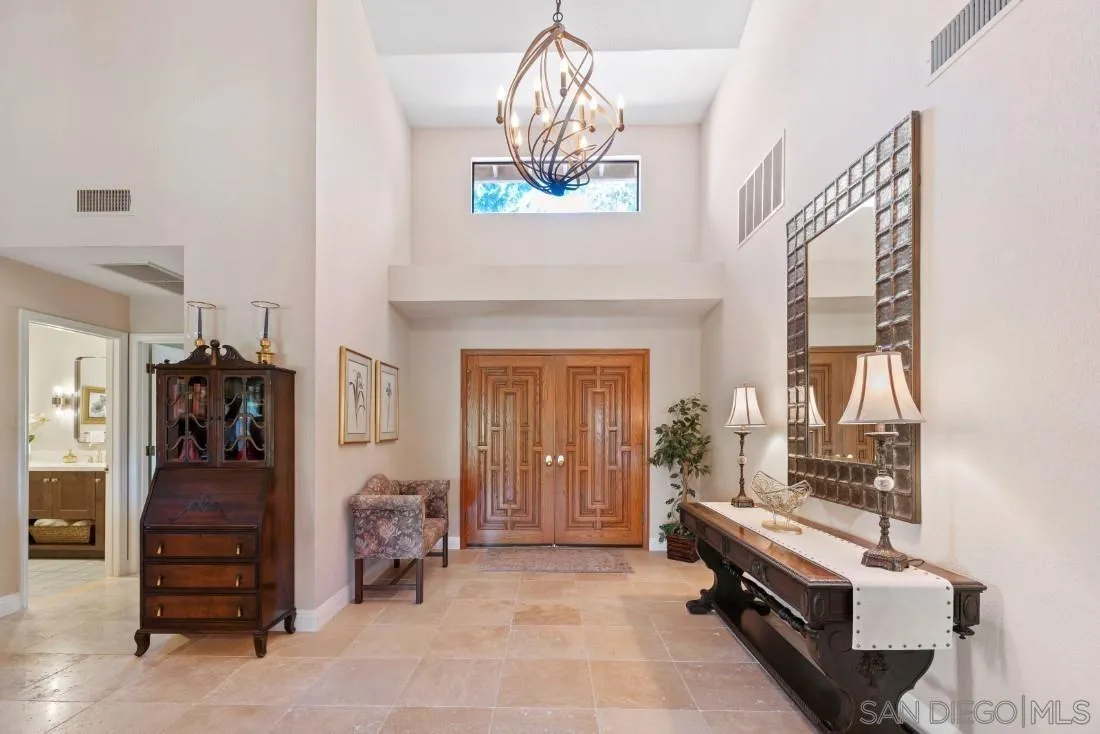 12904 Stone Canyon Road Poway, CA 92064 - Photo 6 of 72 a living room with furniture and a fireplace