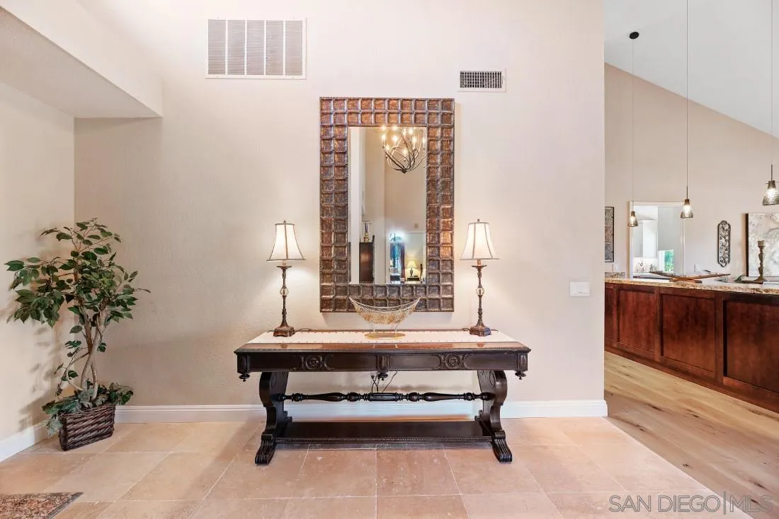 12904 Stone Canyon Road Poway, CA 92064 - Photo 8 of 72 a living room with furniture and a potted plant