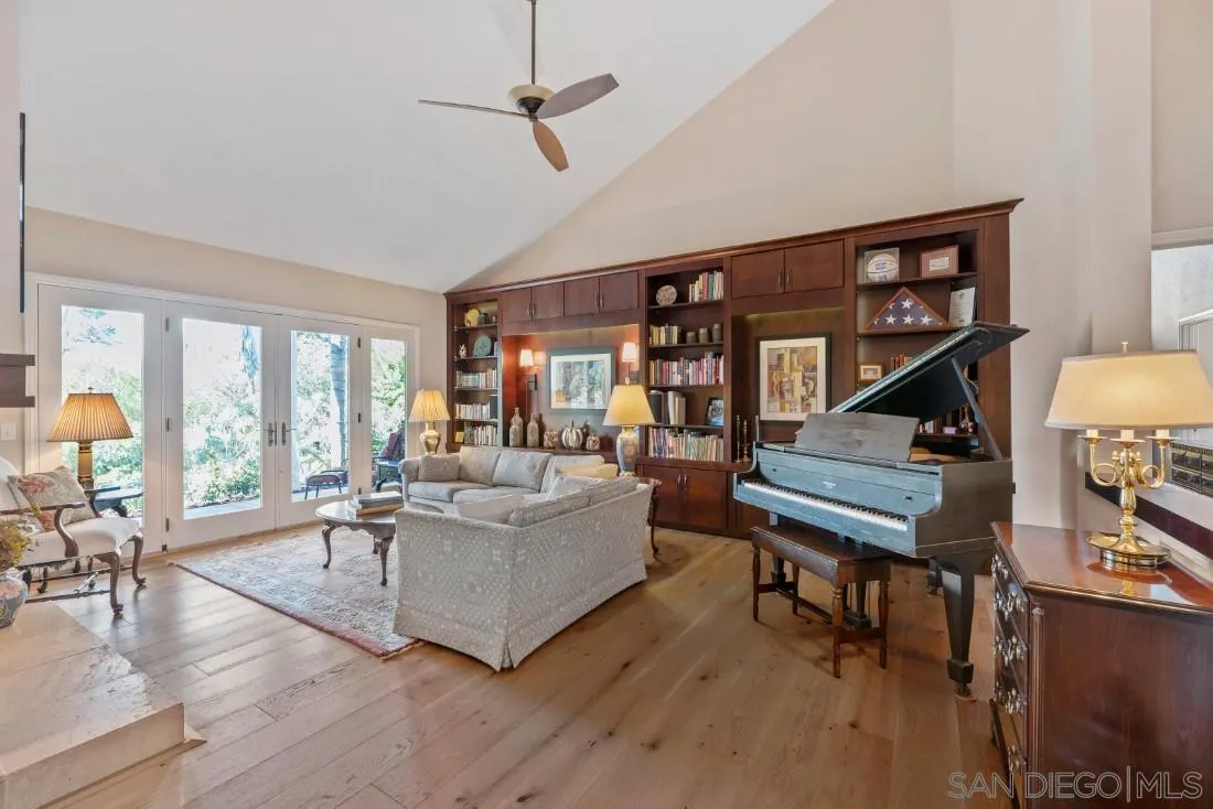 12904 Stone Canyon Road Poway, CA 92064 - Photo 10 of 72 a living room with furniture a rug potted plant and a large window