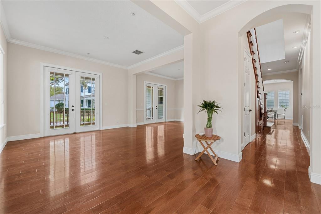 1027 Juel Street Orlando, FL 32814 - Photo 14 of 78 a view of a livingroom with wooden floor and a potted plant