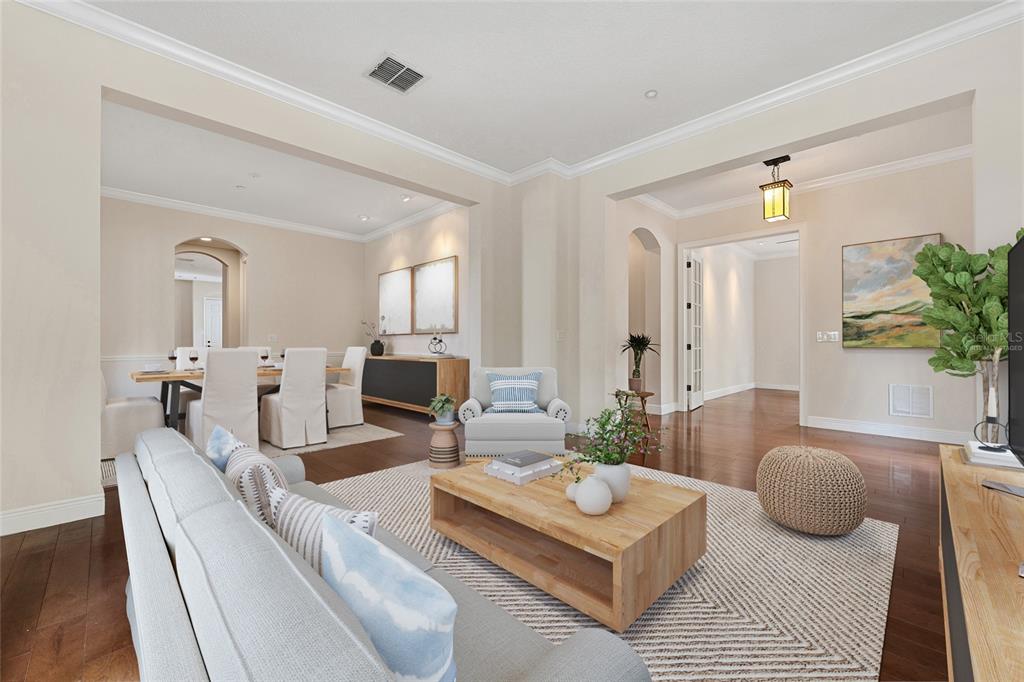 1027 Juel Street Orlando, FL 32814 - Photo 15 of 78 a living room with furniture a rug and a mirror