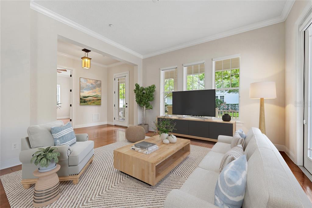 1027 Juel Street Orlando, FL 32814 - Photo 17 of 78 a living room with furniture and a flat screen tv