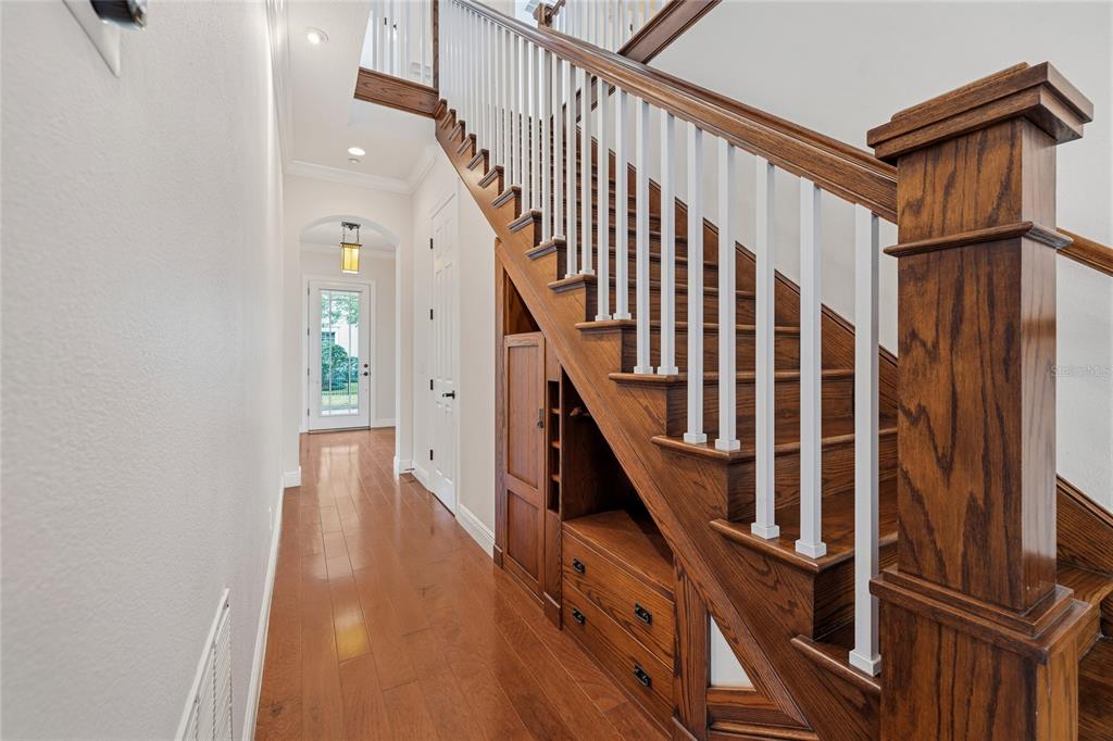 1027 Juel Street Orlando, FL 32814 - Photo 21 of 78 a view of entryway with wooden floor and stairs