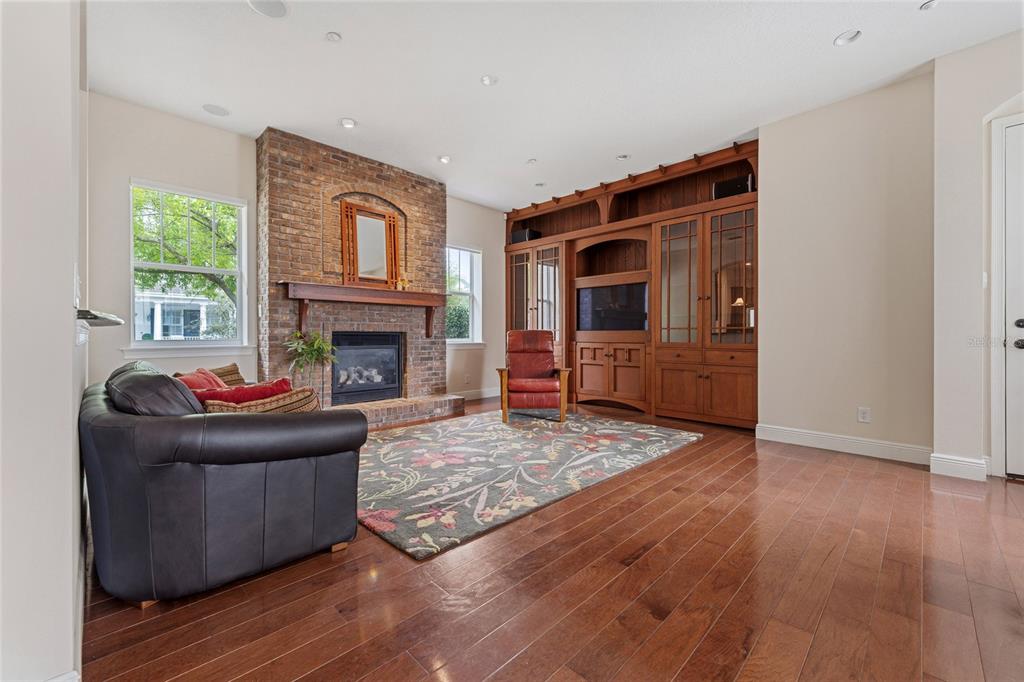 1027 Juel Street Orlando, FL 32814 - Photo 24 of 78 a living room with furniture and a fireplace