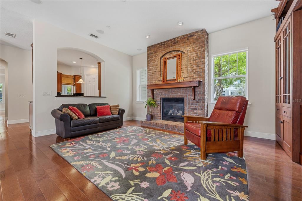 1027 Juel Street Orlando, FL 32814 - Photo 25 of 78 a living room with furniture and a fireplace