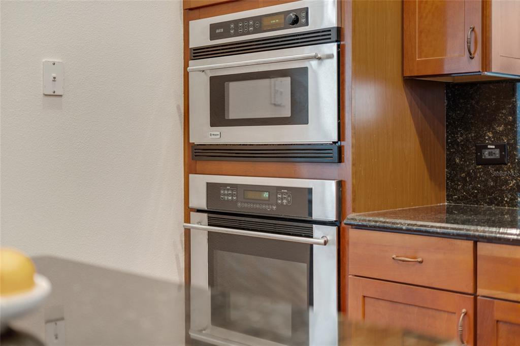 1027 Juel Street Orlando, FL 32814 - Photo 32 of 78 a stove top oven sitting inside of a kitchen