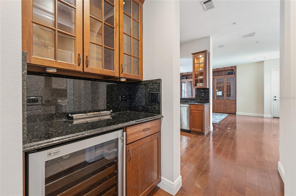 1027 Juel Street Orlando, FL 32814 - Photo 33 of 78 a kitchen with stainless steel appliances granite countertop a stove and a refrigerator