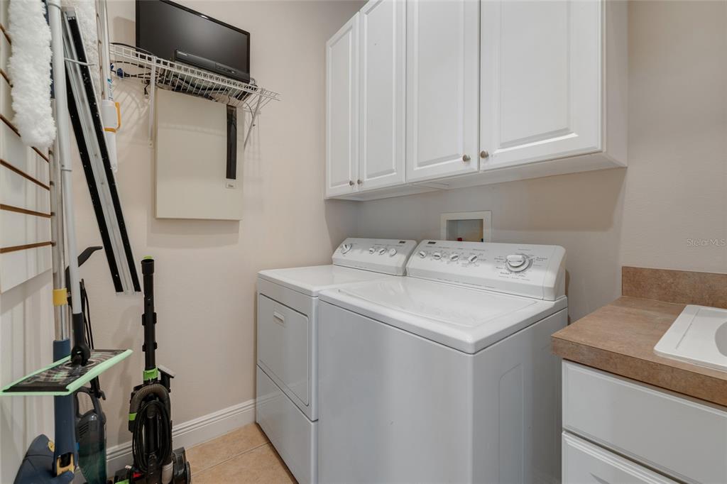1027 Juel Street Orlando, FL 32814 - Photo 34 of 78 a utility room with dryer and washer