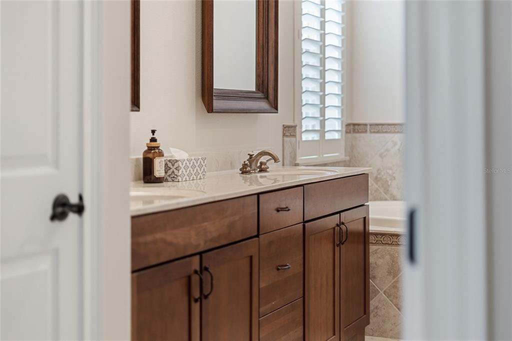 1027 Juel Street Orlando, FL 32814 - Photo 37 of 78 a bathroom with a sink and a mirror