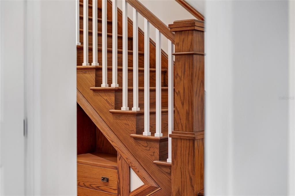1027 Juel Street Orlando, FL 32814 - Photo 42 of 78 a view of staircase with railing and white walls