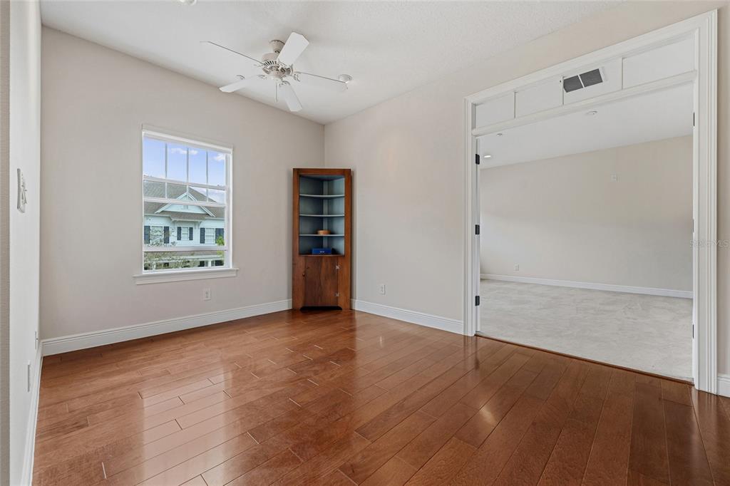 1027 Juel Street Orlando, FL 32814 - Photo 45 of 78 wooden floor in an empty room with a window
