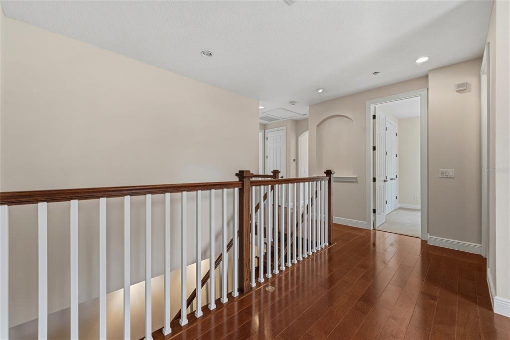1027 Juel Street Orlando, FL 32814 - Photo 46 of 78 a view of a hallway with wooden floor
