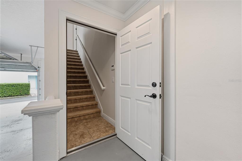 1027 Juel Street Orlando, FL 32814 - Photo 59 of 78 a view of a hallway with wooden floor and entryway