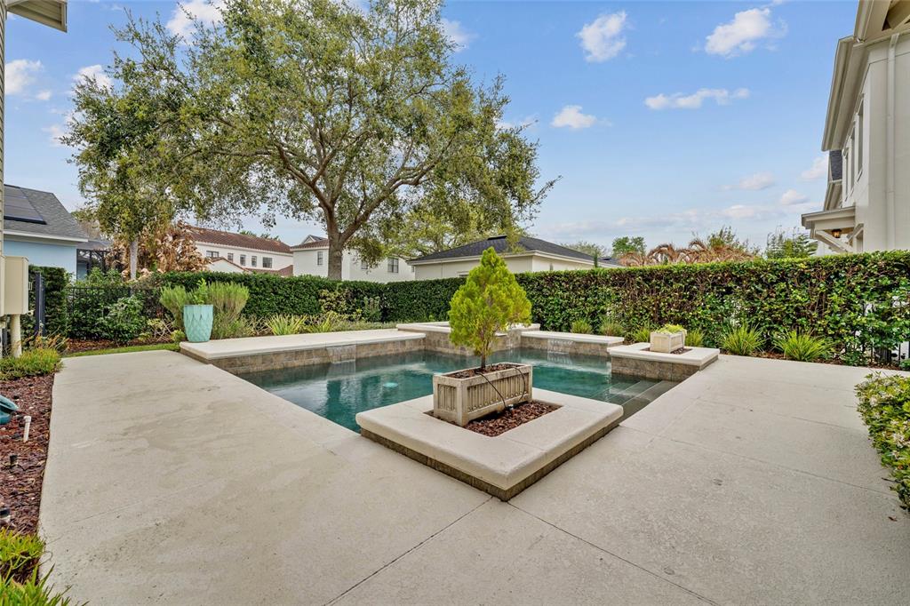 1027 Juel Street Orlando, FL 32814 - Photo 69 of 78 a view of a patio with couches and a table and chairs with wooden fence