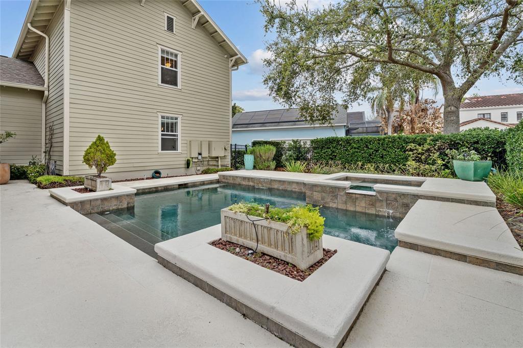 1027 Juel Street Orlando, FL 32814 - Photo 70 of 78 a view of a patio with couches and a dining table and chairs with wooden floor