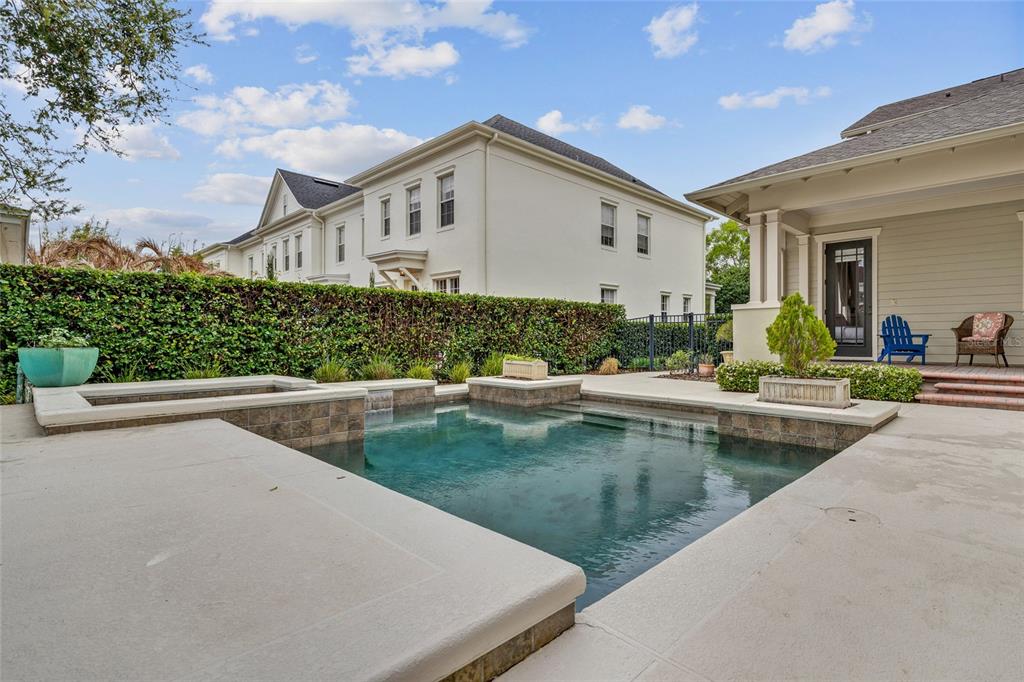 1027 Juel Street Orlando, FL 32814 - Photo 71 of 78 a view of a house with pool and chairs