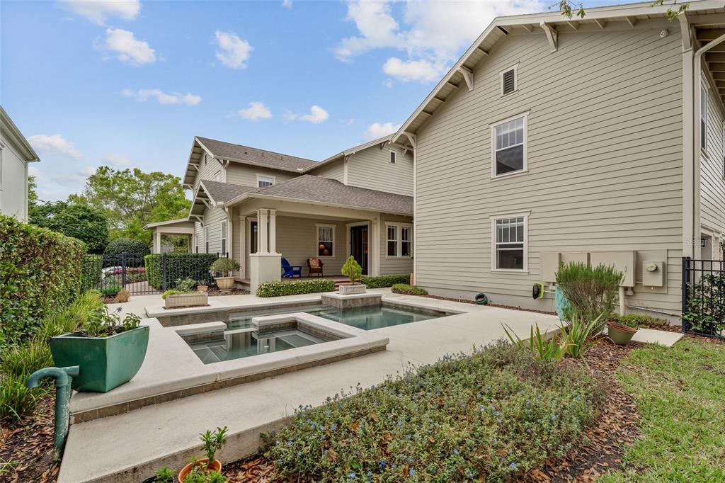 1027 Juel Street Orlando, FL 32814 - Photo 72 of 78 a front view of a house with garden and porch
