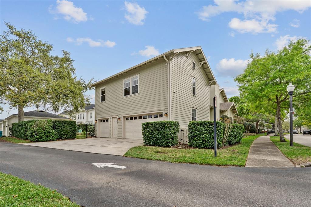 1027 Juel Street Orlando, FL 32814 - Photo 73 of 78 a front view of a house with a yard and a garage