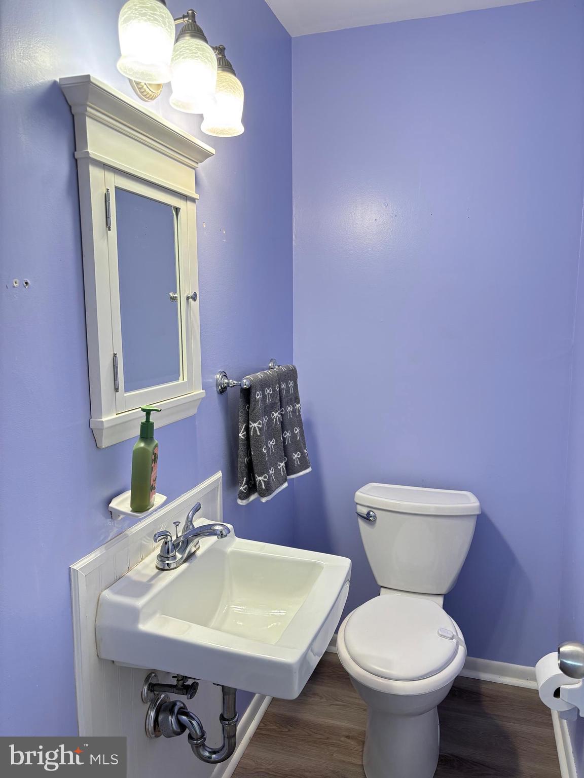 1011 South Beecham Road Williamstown, NJ 08094 - Photo 16 of 23 a bathroom with a toilet sink and mirror