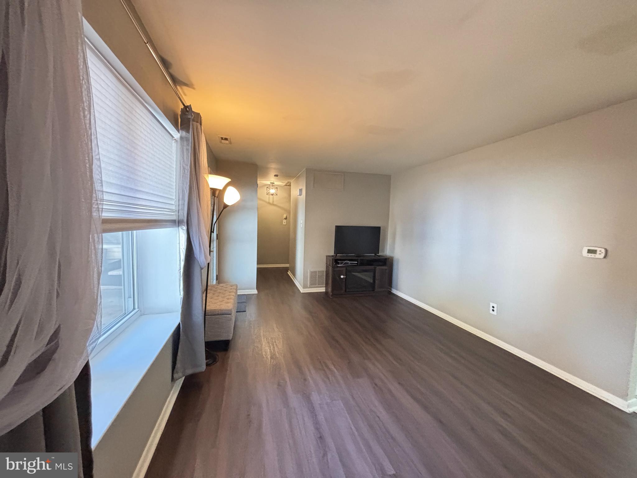 1011 South Beecham Road Williamstown, NJ 08094 - Photo 8 of 23 a view of empty room with wooden floor