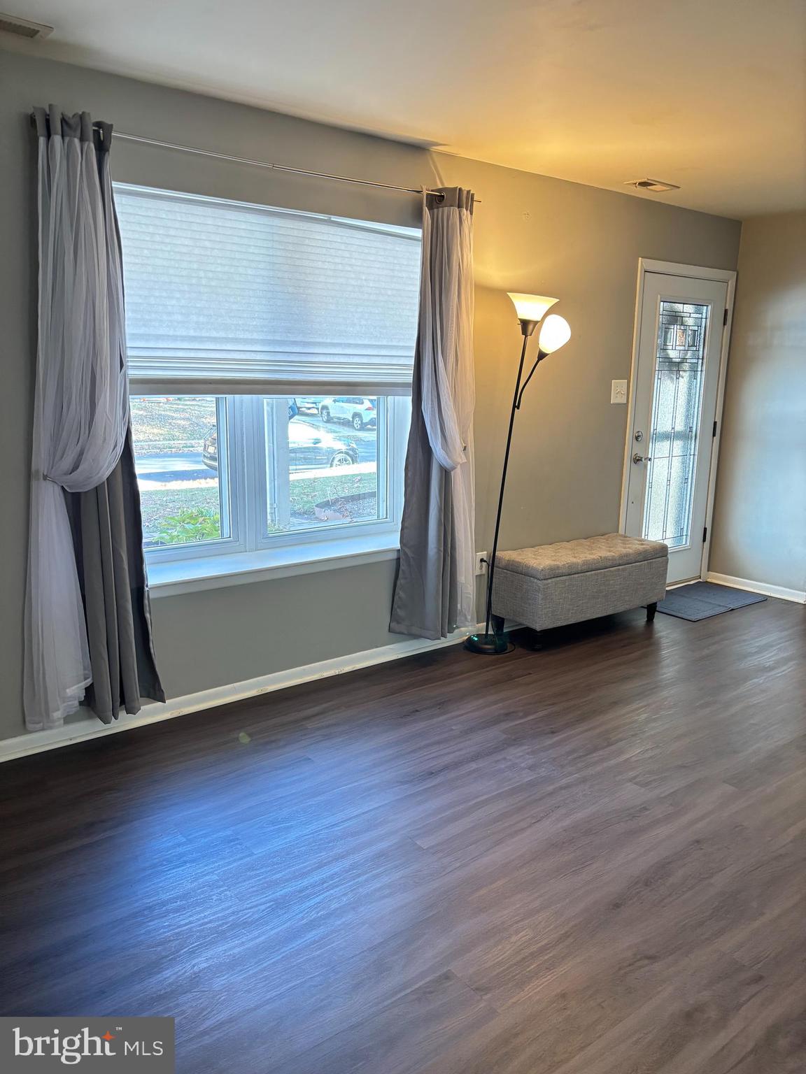 1011 South Beecham Road Williamstown, NJ 08094 - Photo 9 of 23 an empty room with wooden floor and a window