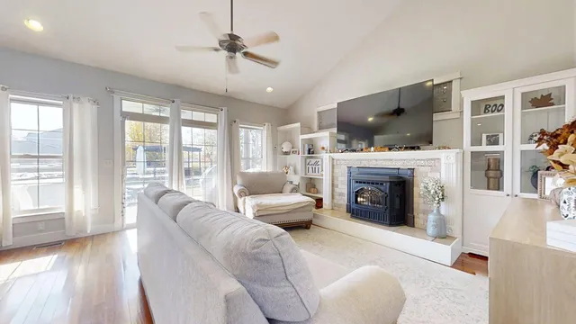 a living room with furniture fireplace and flat screen tv