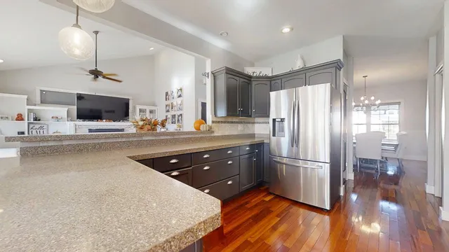 a view of a livingroom with furniture and a flat screen tv