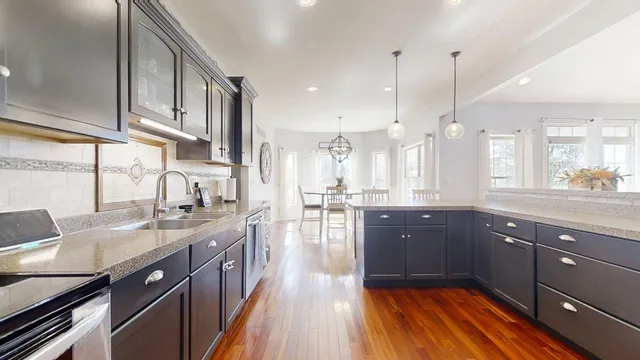 a view of a room with furniture and a window