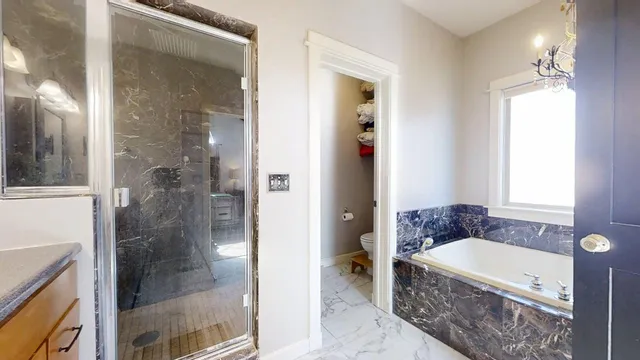 a living room with furniture a refrigerator and a dining table