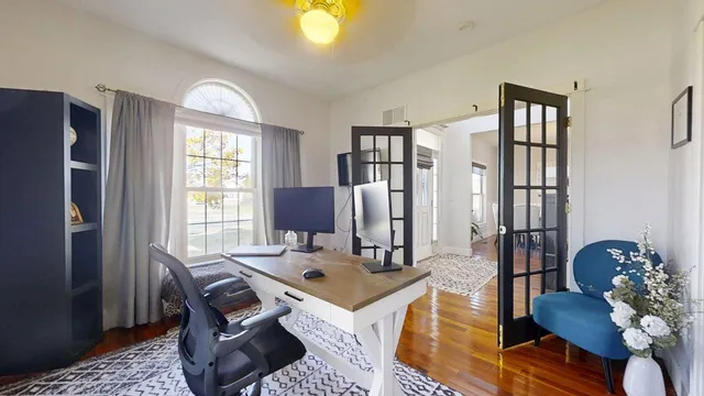 a view of a kitchen with furniture and a stove