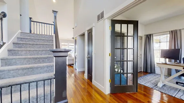 a view of dining room and hall with wooden floor