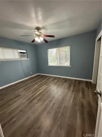 a view of room with window and ceiling fan