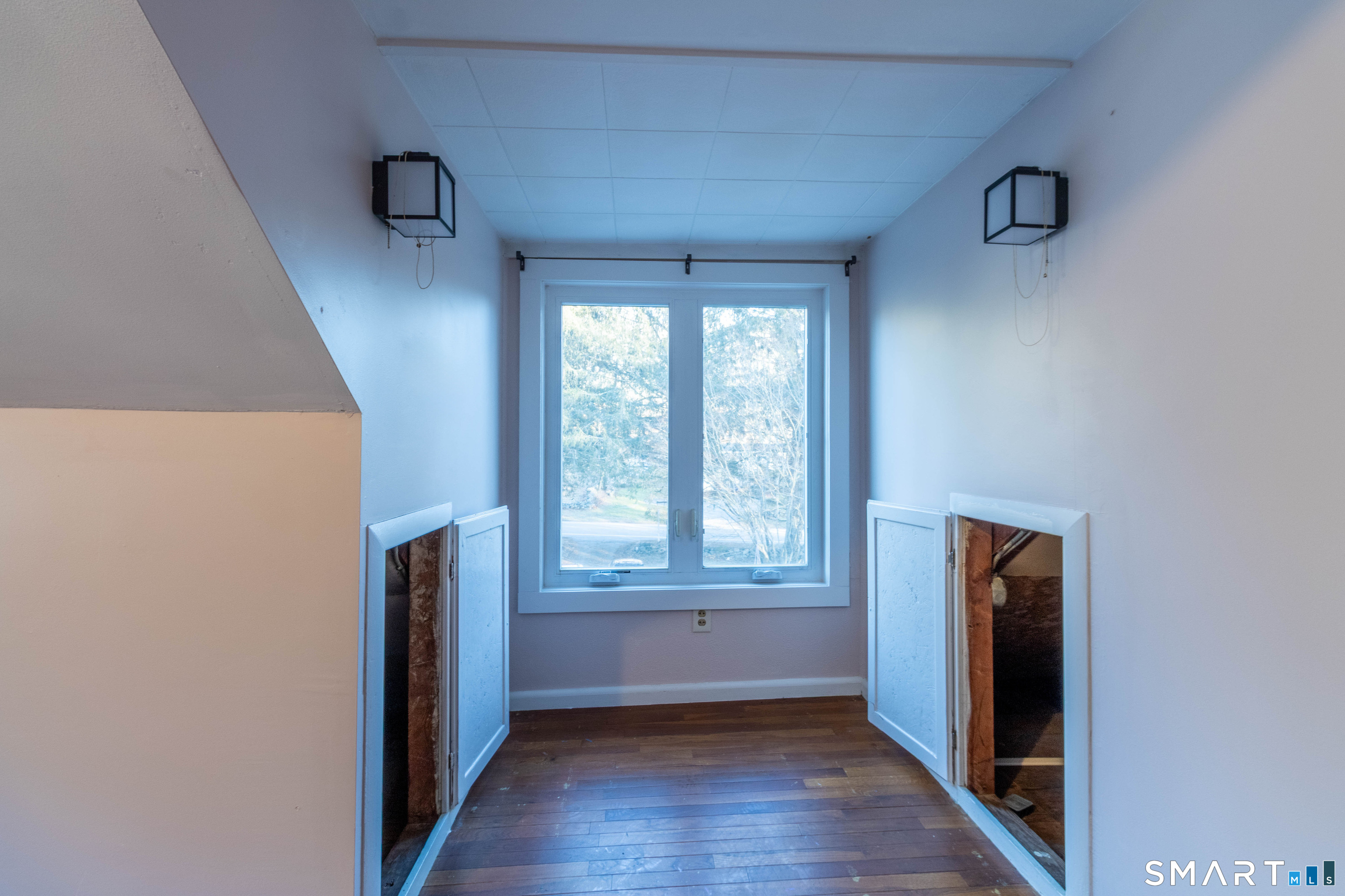 1661 Center Groton Road Ledyard, CT 06339 - Photo 36 of 39 a view of hallway with window and wooden floor