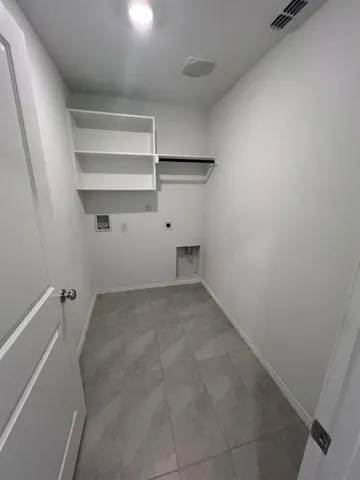 an empty room with a empty space and windows