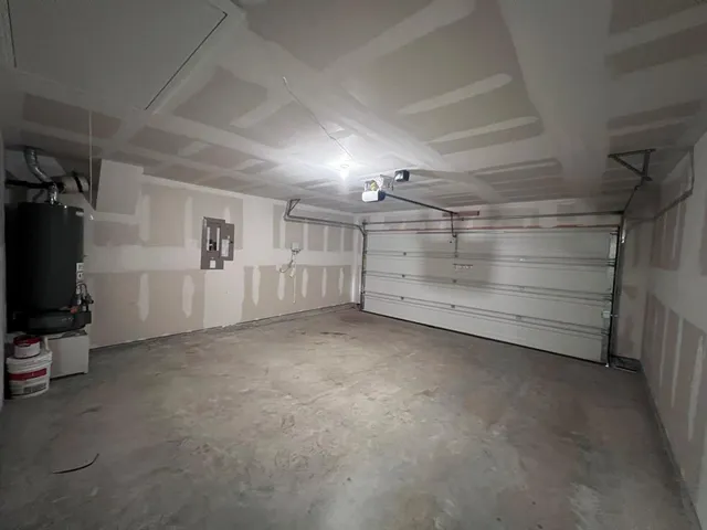 a bathroom with a granite countertop toilet a sink and a mirror