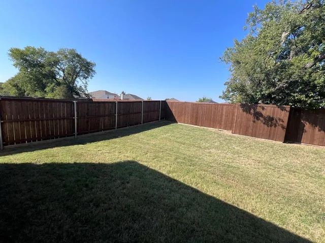 a kitchen with a sink cabinets and a window