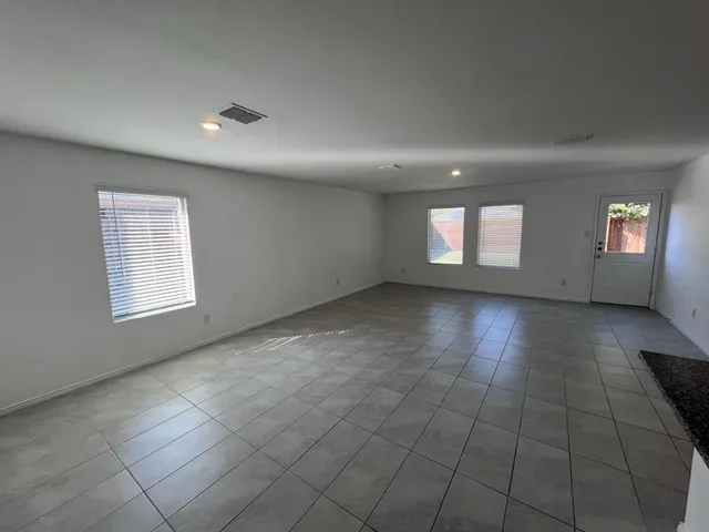 a kitchen with a sink and a stove top oven