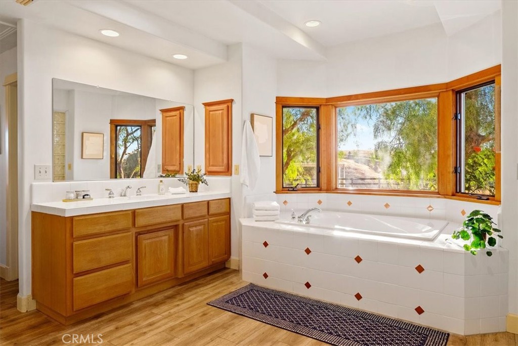 5745 Iron Gate Road Paso Robles, CA 93446 - Photo 26 of 58 Primary Suite features a large soaking tub with garden views.