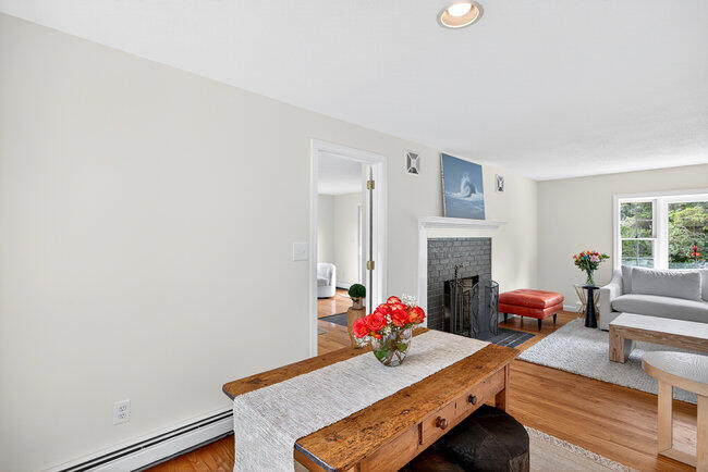 20 Mutiny Way Mashpee, MA 02649 - Photo 12 of 36 a bedroom with furniture and a fireplace